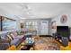 Inviting living room with cozy gray couch, contemporary decor, and plenty of natural light at 5840 30Th S Ave # 305, Gulfport, FL 33707