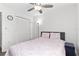 Comfortable bedroom featuring a ceiling fan, a large window and ample closet space at 621 Chilt Dr, Brandon, FL 33510