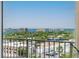 Balcony view with a metal fence and the city and sea in the background at 628 Cleveland St # 907, Clearwater, FL 33755