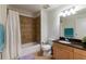 Bathroom with a tub/shower combo and a wooden vanity with dark countertop at 628 Cleveland St # 907, Clearwater, FL 33755