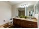 Bathroom vanity with granite counters, double sinks, and tiled flooring at 628 Cleveland St # 907, Clearwater, FL 33755