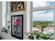 Bedroom view with several floral painting and a wonderful view out the windows at 628 Cleveland St # 907, Clearwater, FL 33755