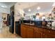 Functional kitchen space with granite counters, wooden cabinets, and modern black appliances at 628 Cleveland St # 907, Clearwater, FL 33755