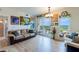 Comfortable living room with a large sliding glass door to a balcony with views of the city at 628 Cleveland St # 907, Clearwater, FL 33755