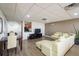 An entertainment area offers stylish seating, dining space, and a kitchenette for modern living at 628 Cleveland St # 907, Clearwater, FL 33755