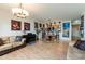 Open concept living and dining room space with beautiful wood floors and art at 628 Cleveland St # 907, Clearwater, FL 33755