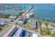 Aerial shot with a red arrow of the condo community near the bay and bridge at 100 Bluff View Dr # 317A, Belleair Bluffs, FL 33770