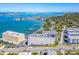 An aerial shot of condominiums in a waterfront community with docks and parking at 100 Bluff View Dr # 317A, Belleair Bluffs, FL 33770