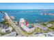 Aerial shot of the condominiums with a red arrow marking the location near the bay and ocean at 100 Bluff View Dr # 317A, Belleair Bluffs, FL 33770