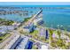 Stunning aerial view of a waterfront property with a scenic bridge and beautiful coastal surroundings at 100 Bluff View Dr # 317A, Belleair Bluffs, FL 33770