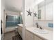 Bathroom with a shower-tub combination and a single sink vanity at 100 Bluff View Dr # 317A, Belleair Bluffs, FL 33770