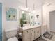 Bathroom featuring a vanity with pendant lights and a shower-tub combination at 100 Bluff View Dr # 317A, Belleair Bluffs, FL 33770