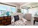 Comfortable living room seating with beautiful outdoor view at 100 Bluff View Dr # 317A, Belleair Bluffs, FL 33770