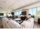 Large and comfortable lounge area with oversized windows and waterfront views at 100 Bluff View Dr # 317A, Belleair Bluffs, FL 33770