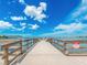 Private property pier offers stunning waterfront views with clear blue skies at 100 Bluff View Dr # 317A, Belleair Bluffs, FL 33770