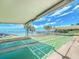 Shuffleboard courts with waterfront views and shaded benches offer a relaxing outdoor activity at 100 Bluff View Dr # 317A, Belleair Bluffs, FL 33770