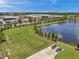 Aerial view of the lake, dog park, and industrial buildings at 10105 Paradise Fish Dr, Riverview, FL 33578