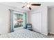 Bedroom with a ceiling fan, large window, and closet for ample storage at 10105 Paradise Fish Dr, Riverview, FL 33578