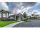 Community clubhouse with manicured landscaping, sidewalks, and parking at 10105 Paradise Fish Dr, Riverview, FL 33578
