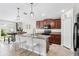 Well-appointed kitchen with granite countertops, stainless steel appliances, and a convenient breakfast bar at 10105 Paradise Fish Dr, Riverview, FL 33578