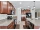 Contemporary kitchen with stainless steel appliances, rich wood cabinets, and a functional layout for cooking at 10105 Paradise Fish Dr, Riverview, FL 33578