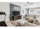 Stylish living room features a neutral color palette, plush sectional sofa, and a contemporary entertainment center at 10105 Paradise Fish Dr, Riverview, FL 33578