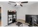 Office space with a desk, shelving unit, and modern computer setup at 10105 Paradise Fish Dr, Riverview, FL 33578