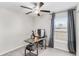 Bright office with a modern desk, chair, and large window at 10105 Paradise Fish Dr, Riverview, FL 33578