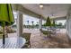 Outdoor patio furniture and umbrellas overlooking the community pool at 10105 Paradise Fish Dr, Riverview, FL 33578