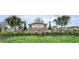 Community entrance sign with decorative landscaping at 10105 Paradise Fish Dr, Riverview, FL 33578