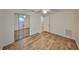 Bedroom featuring hardwood floors, a closet with folding doors, and neutral paint at 1015 Hardwood Dr, Valrico, FL 33596