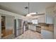 Well-lit kitchen featuring stainless steel appliances, granite countertops, and white cabinetry at 1015 Hardwood Dr, Valrico, FL 33596