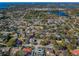 Aerial view showcasing the neighborhood's close proximity to water and lush green trees at 1017 Jamaica Way, Tarpon Springs, FL 34689
