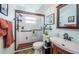 Bathroom boasts glass enclosed shower and vanity sink at 1017 Jamaica Way, Tarpon Springs, FL 34689