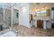 Bathroom showcasing a glass enclosed shower and double sinks at 1017 Jamaica Way, Tarpon Springs, FL 34689