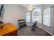 Bedroom with weights, bench, and large window at 1017 Jamaica Way, Tarpon Springs, FL 34689