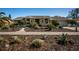 Beautiful home with well-manicured landscaping, complemented by dark mulch and an inviting walkway at 1017 Jamaica Way, Tarpon Springs, FL 34689