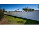 A tall white fence encloses the property, providing privacy and security at 1017 Jamaica Way, Tarpon Springs, FL 34689