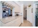 Open-concept kitchen with granite counters and view to living room at 1017 Jamaica Way, Tarpon Springs, FL 34689