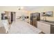 Contemporary kitchen featuring stainless steel appliances, granite countertops, and ample cabinet space at 1017 Jamaica Way, Tarpon Springs, FL 34689