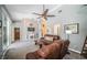 Relaxing living room with fireplace and glass doors leading to a lanai and pool, ideal for indoor/outdoor living at 1017 Jamaica Way, Tarpon Springs, FL 34689
