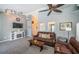 Living room area with modern fireplace, TV and comfortable seating with view to the entry at 1017 Jamaica Way, Tarpon Springs, FL 34689
