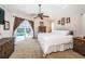 Bright main bedroom with access to a pool area and neutral walls at 1017 Jamaica Way, Tarpon Springs, FL 34689