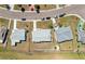 Birds-eye view showcases the neighborhood layout, along with the property's neat landscaping and backyard at 1021 Augusta Dr, Sun City Center, FL 33573