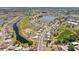 Scenic aerial shot showcasing a residential area in Sun City Center, featuring water and green spaces at 1021 Augusta Dr, Sun City Center, FL 33573