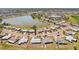 Beautiful aerial shot capturing homes in Sun City Center surrounding a tranquil lake, highlighting community living at 1021 Augusta Dr, Sun City Center, FL 33573