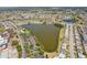 Expansive aerial view of the Sun City Center neighborhood surrounding a beautiful lake and residential area at 1021 Augusta Dr, Sun City Center, FL 33573