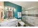 Updated bathroom featuring stylish vanity, modern fixtures, and a glass enclosed shower with decorative tile at 1021 Augusta Dr, Sun City Center, FL 33573