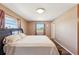 Comfortable bedroom with wood floors, a window offering natural light, and neutral colored walls at 1021 Augusta Dr, Sun City Center, FL 33573