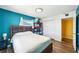 Bedroom features hardwood floors, a large bed, closet space, and views of the outside at 1021 Augusta Dr, Sun City Center, FL 33573
